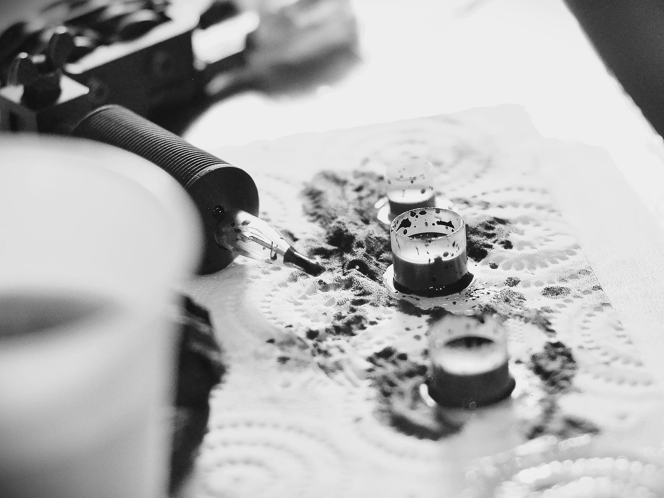 Tattoo artist working in a calm, organised studio environment